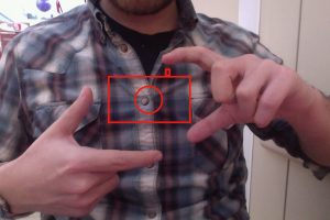 写真をとる手振り